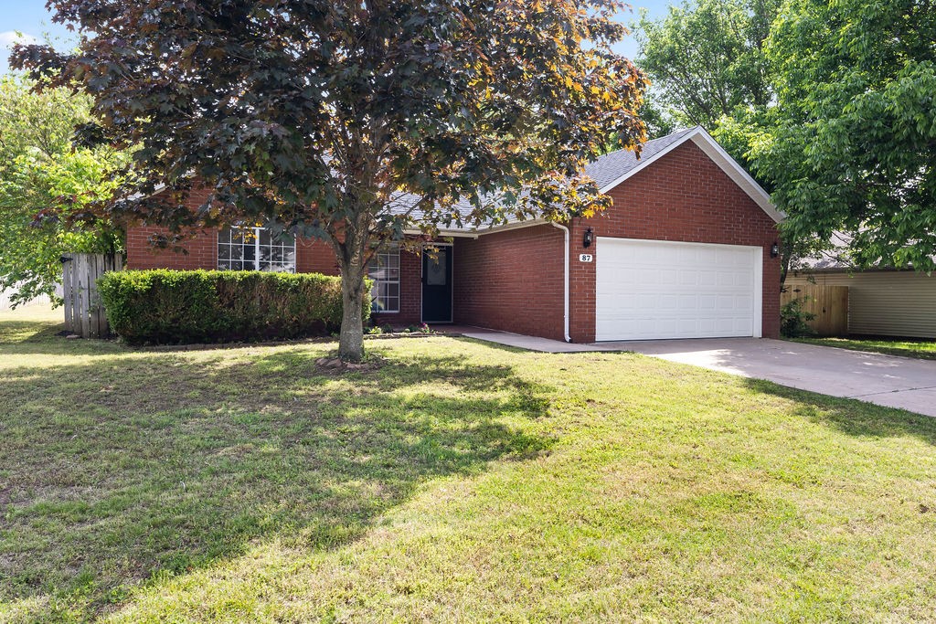 Delightful home in the South Haven Subdivision! Splendid open layout providing the family with functionality for everyone. Vaulted ceilings, gas-log fireplace and fabulous natural light produces the warm and inviting ambiance that we all crave. Lovely eat-in kitchen is equipped with granite countertops, wrap around counter and pantry. Separate laundry helps to keep things tidy. Split bedroom floorplan with spacious bedrooms. Primary bedroom offers his & her separate closets and sinks. Spacious backyard offers plenty of room for kids or pets to play with storage building with electrical already hooked up, giving options for all your projects. Covered patio has gas hook-up creating a wonderful space for outdoor cooking. Nestled in welcoming neighborhood making it easy to feel right at home. Located close to shopping, dining and only 10 minutes away from University of Arkansas. Convenient access to I-49 allowing for commutes to be a breeze. Move-in ready and waiting for you!
