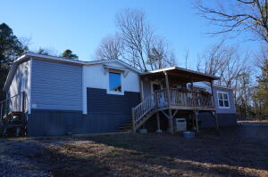 Come take a look at this newly remodeled 2 bed, 2 full bath home! Just outside of town all sitting on 1 acre. New privacy fence, new roof, new plumbing, new electric, new sub floor and new flooring! Also included with this property is a detached guest house/mother-in-law quarterers with a full kitchen, bathroom and laundry. Giving this property a total of 1432 sq ft per the owner including the main home 1,000 sq ft and guest home 432 sq ft. There are several out buildings and large truck container that will convey with the sell of this property!