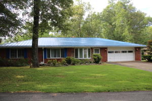 Brick home on 3 lots totaling almost 1 level acre. Home features attached garage with heat and work bench. Stone fireplace with wood insert and a whole house gas generator. Two master suites, covered deck over-looking the woods in a very quiet setting. Only minutes to the Bull Shoals Lake for fishing, boating and swimming.