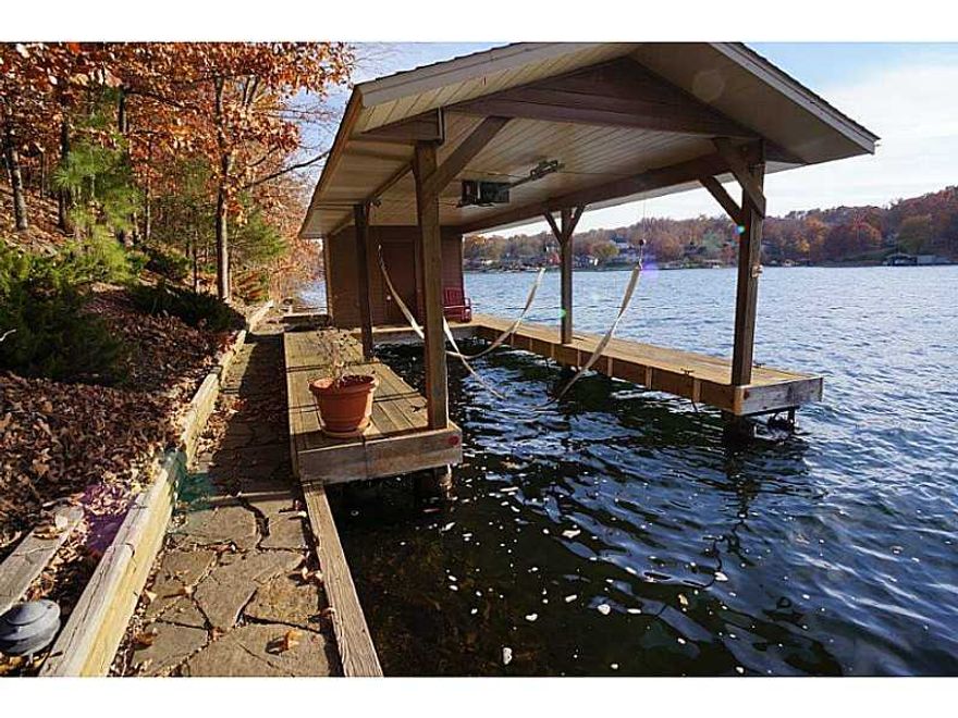 Breath taking Loch Lomond home, completely remodeled in 2012.  Home features crown molding, granite countertops, custom cabinets, Wolf gas cooking stove, double ovens.  Amazing lake view from new installed deck.  Lake views from 7 rooms in the home.,New installed kitchen/wet bar on the lower level perfect for entertaining.  Game room has a pool table that stays.  All this with and a Boathouse with a lift to go with the Gazebo at the water.  1.8 Acres of paradise!