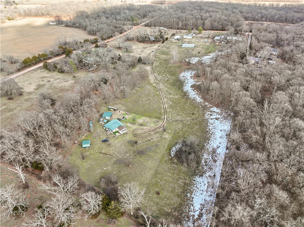 This flat 9.54 acres is ready for your dream plans. Sitting just off Vaughn Road and only 15 minutes from the airport this is the convenient location you have been looking for. This land is flat and ready for your hobby farm, massive garden, horses, etc. Water and electricity are at the street and there is plenty of room to place a septic system. The land sits outside of city limits, which means there are fewer restrictions on what you can do with the parcel. Certain uses, such as mobile homes or multi-family housing, would require a permit from the county (but could be possible). Come see this gorgeous parcel of land and then make it your own! All improvements on the land sold as-is. The 1,367 Square foot home on the land was built in 2015 but would not eligible for any mortgage (no heat/air/water/electric/septic). It would make a great storage building or could simply be cleared from the property. Come see this gorgeous parcel of land and then make it your own! All improvements on the land sold as-is.