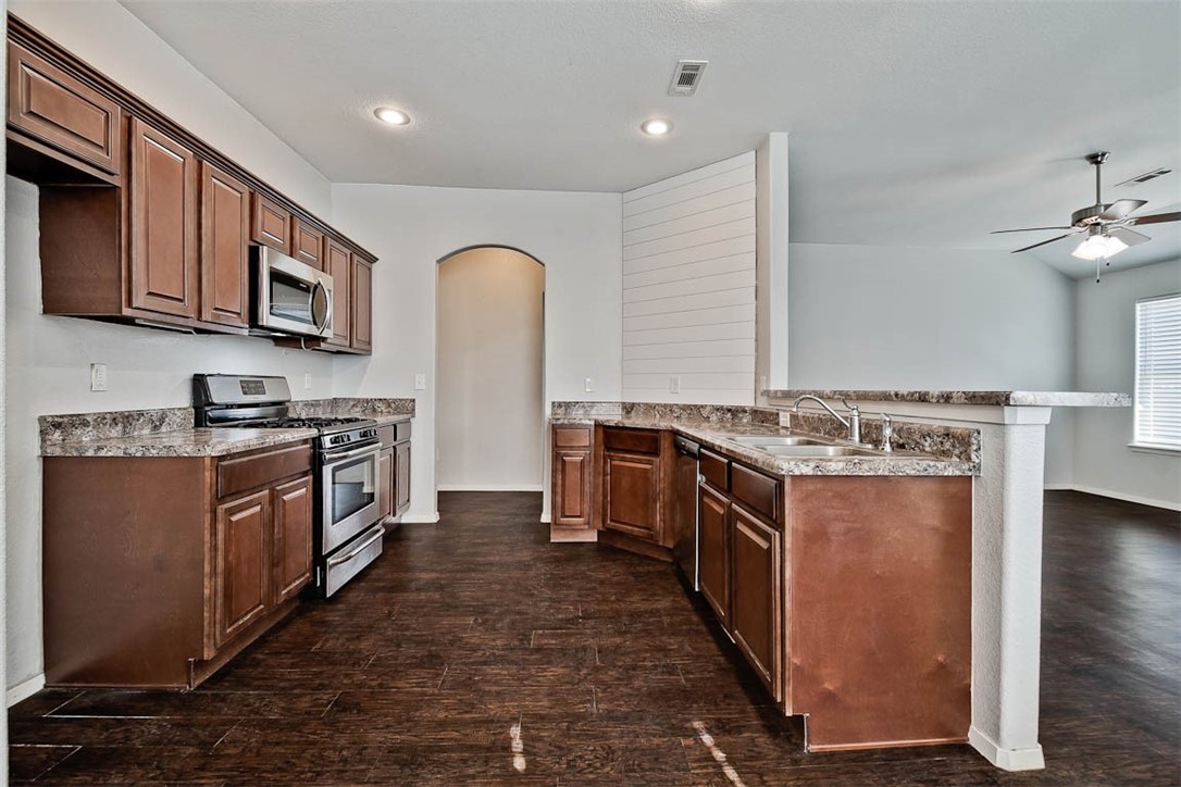 Adorable home ready to move into! Home features a split floor plan. Eat in Kitchen opens to living room, separated by a bar height counter that could fit 3-4 bar stools. Living areas feature beautiful engineered wood flooring and has been repainted within the last two years. Utility room is spacious with extra storage that has been used as a pantry. Large 1/4 acre lot is fenced and features a couple mature trees. There is a partially covered patio, perfect for entertaining. Highest and best offers are encouraged and must accompany a pre-approval letter or proof of funds. Offers will be reviewed Monday, January 17, 2021 at 5:00 p.m.