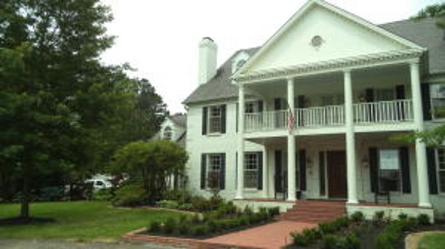 910 Skyline Drive - Quality, location and price set this house apart from any other home on the market.  From the circle drive to the brick paver front veranda to the grand foyer this house boasts pride of ownership.  Custom black walnut craftsmanship by renowned woodworker Lyle Ratzlaff is evident everywhere.  Commercial appliances by Subzero and Thermador. Double veranda on back overlooks boxw