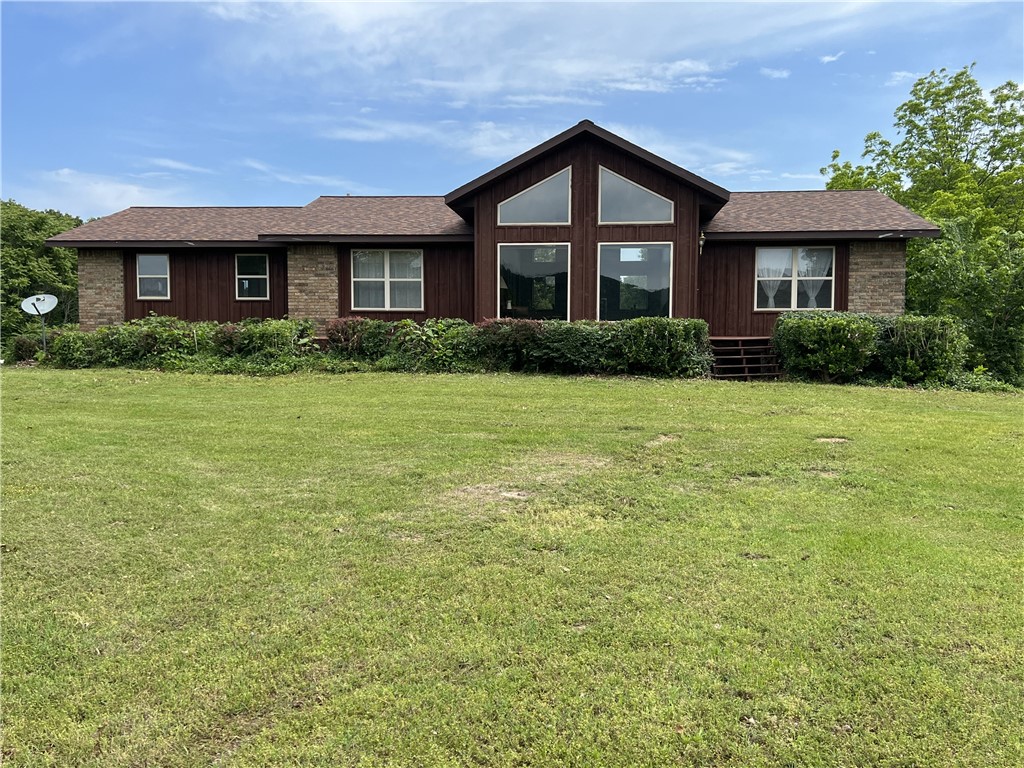 Idyllic 80 acre farm with 4 BR-3 BA, 3,014 SQFT home!! This one-owner home features cathedral ceilings, floor-to-ceiling living room windows, walk-in closets, a galley kitchen, large screened in porch, beautiful brick fireplace with wood insert, and wood stove. The 80 acres feature about 25 acres of pasture with 2 fenced areas, two ponds, and a large machine shed. Deer, bear, turkey, and elk have been seen on the property. Excellent hunting, seasonal creek, rolling topography, private location, and all home appliances and gun safe convey. Approximately 25 minutes into Harrison.