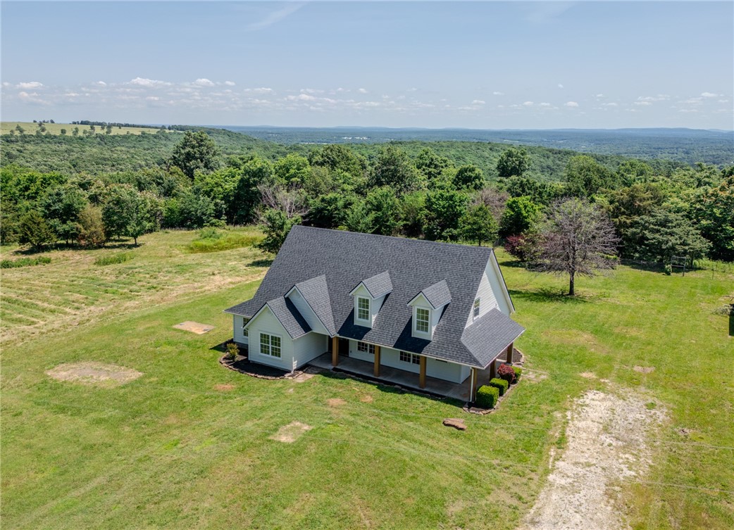 Stunning Lincoln Farmhouse – Fully Renovated on 5 Private Acres! Welcome to 12942 N Jackson Hwy, Lincoln, AR – a breathtaking 2,758 sqft, 5-bed, 3-bath modern farmhouse on 5 level acres with gorgeous views. Fully renovated with fresh interior/exterior paint, new landscaping, new roof, HVAC, LVP flooring, appliances, lighting, and fixtures. Soar under cathedral ceilings, entertain on the wrap-around porch, or relax on the primary suite’s private deck. An upstairs bonus room adds flexibility, and a 1,200 sqft barn/shop is perfect for hobbies. Nestled in NW Arkansas’s thriving market, it’s just 15 mins to Siloam Springs, 20 mins to Fayetteville, and 5 mins to Lake Wedington. Ideal for families or homesteaders seeking rural charm with city access. Move-in ready and priced to sell – schedule your tour today!
