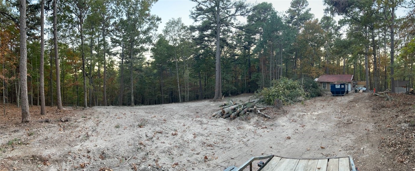 Nature's Calling! Come build your own private Oasis where everything is already ready for you. This lot has an existing septic system (inspected and cleaned), New 400 amp electric box with 30 amp hookup for an RV, Existing Well, Poured slab with studs and city water hookup is at street! A Partial Survey has been performed and most of the trees have been cut and cleared from the recent storms. Just minutes from War Eagle Cavern, Hobbs State Park, multiple boat launch sites, and over 50 Miles of Hiking/Biking Trails. With Onyx Coffee Labs just a 15 minute drive away, you've got it all!