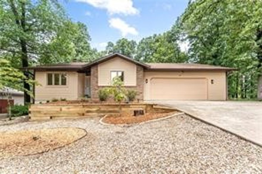 Tucked in Dunvegan near Loch Lomond, this refreshed single-level home is truly move-in ready. You’ll love the open, light-filled layout with updated LVP flooring, quartz counters, modern fixtures, and a gas-log fireplace anchoring the main living area. The split bedroom design gives the private main suite a tiled walk-in shower, dual sinks, and walk-in closet, while two additional rooms, one can be used as ate a flexible guest/office wing. A bright sunroom adds extra space for an office, workout area, or second living space overlooking a rare flat backyard that actually works for pets, play, gardening, or a firepit. Outside you’ll find an attached 2-car garage, extra gravel parking for guests, a boat, or trailer, and easy curb appeal. Minutes to Hwy 71, Tunnel Vision and Lago Vista MTB trails, lakes, golf, pools, and Bella Vista club amenities—ideal for soaking up the NWA lifestyle year-round.