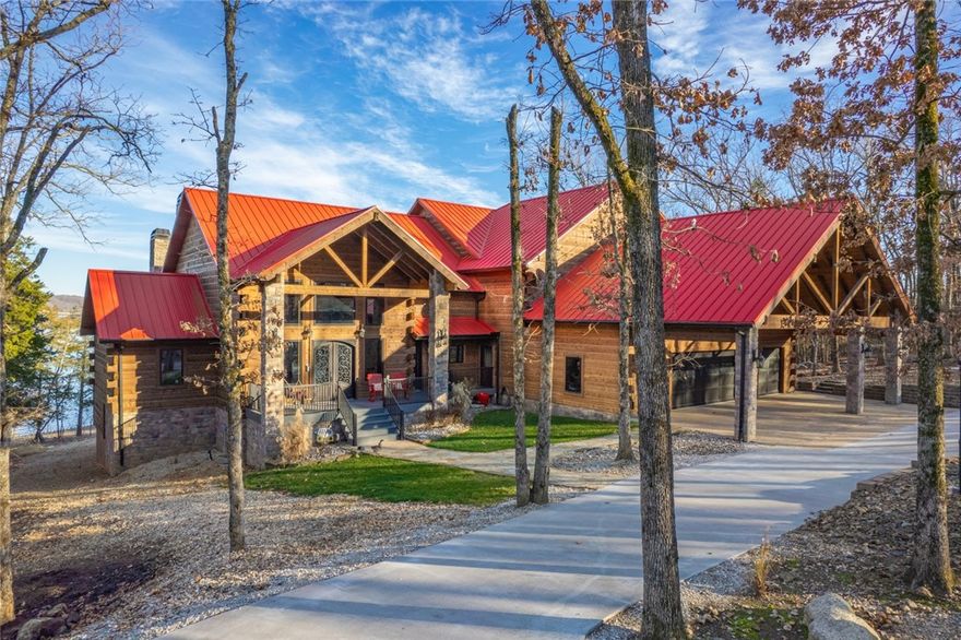 Where luxury meets Rocky Mountain Lodge on Beaver Lake, just steps from the water! 2-slip PRIVATE BOAT DOCK with solar power, 2 lifts & swim platform. New 30'x24' SHOP that is heated/cooled! Superior construction throughout, this impressive custom home has year-round lake views and boasts 2 kitchens, 2 laundry rooms, 2 master suites, 2 offices, 3 living areas, theatre room, game room, home gym/exercise room. Huge Butler's Pantry with 2nd oven, ample storage. All bedrooms have ensuite bathrooms. Soaring wood ceilings, expansive Pella windows, engineered wood floors, heated travertine stone tile floors, 4 fireplaces, "sonic ice" machine, surround sound/indoors & out, whole house Generac, 3 covered decks, too many details to list here! Ask your agent for list of amenities. Be sure to check out the video! Many furnishings and other items are negotiable with acceptable offer. Listing agent must be present for showings. Security system with surveillance. Pre-qualified buyers only.