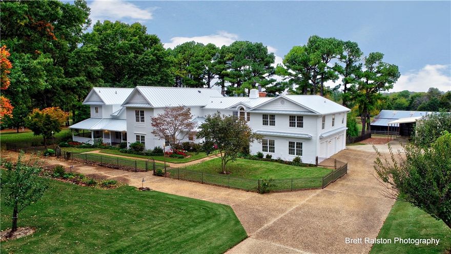 Fabulous estate home situated on 7.11 acres complete with in-ground pool, pool house, shop building, two barns, small pond w/fountain & gorgeous landscaping.  The home has been updated, kitchen remodeled, screened-in room converted to sunroom w/HVAC. FLR, FDR, DEN, EIK, 5BR, 5BA. Choose between either first or second floor owner suite.  Kitchen has granite & soapstone countertops, upgraded appliances.  Doors are solid wood.  House is well insulated w/cellulose insulation.  Large media room upstairs. Abundance of storage throughout the home & spacious closets.  Truly too much to describe here.   Home is pristinely maintained & in immaculate condition.