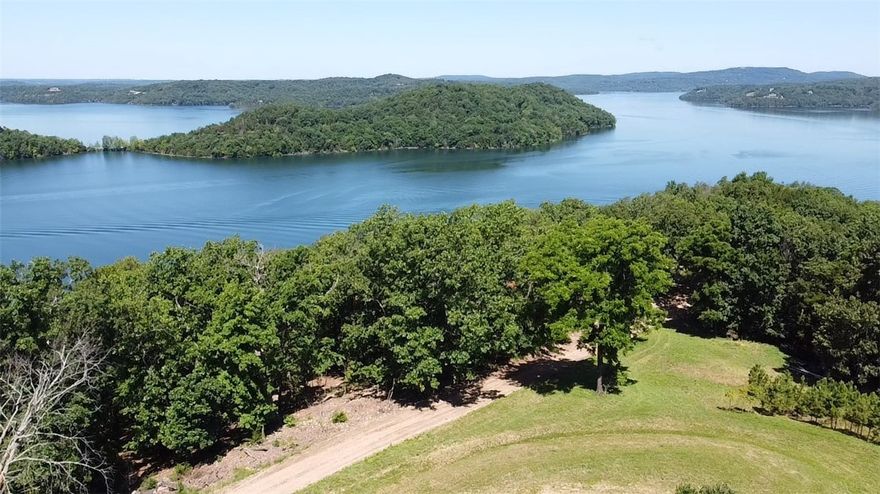 LAKEFRONT--Tract 3 offers an easy walk down to the water with 100' of shoreline & a very rare flat beach, 12' x 20' shed for lake toys with electric service available only 8 ft away ($ savings), close to Starkey Marina, Hogscald Cove, Penetentiary Cove & Castle Cove, tons of mature trees for shade and 1/3 interest in a Shared Well Agreement ($ savings).  Tract 2 boasts breathtaking panoramic views of Beaver Lake, 200-amp service & meter with a level & cleared build site already in place-HUGE cost savings! With a little judicious pruning the views will be even more stunning! Both parcels include a maintenance agreement and private driveway easement. If you're looking for lakefront land, off the beaten path you've found it! Listed well-below appraised value & only 4 miles, by car, to Big Clifty boat ramp & 15 miles to Eureka Springs. Perc test for upper acreage (Tract 2) available.