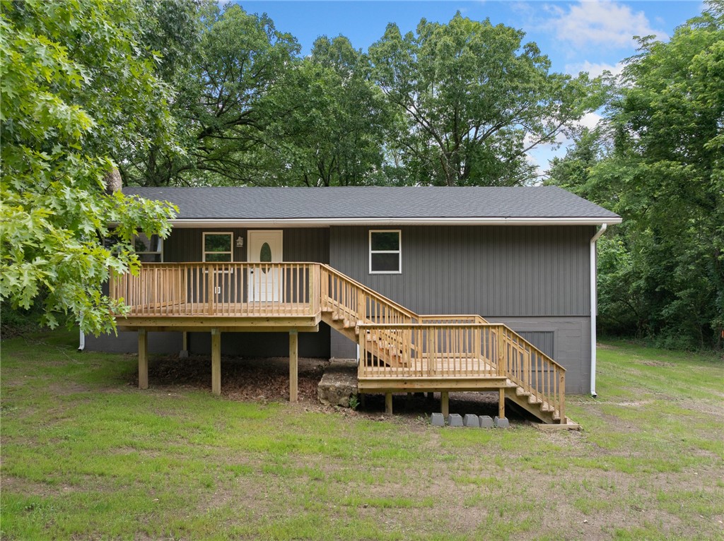 So much space!! Check out this home in Diamond City. Just minutes from the golf course and beautiful Bull Shoals Lake! This 4-bedroom, 3-bathroom home is the perfect vacation retreat, offering space, comfort, and easy access to everything that makes lake life special. The main level features a generous primary suite with a large en-suite bathroom and access to the back deck, plus an additional bedroom. Downstairs, the walk-out basement includes two more bedrooms that share a massive walk-in closet, a full bathroom, and a versatile bonus room. Turn-key and ready to enjoy.