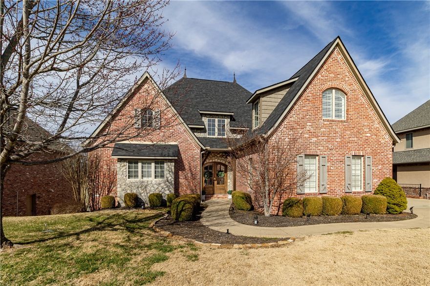 Welcome home to this stunning golf-front home in Shadow Valley Country Club!  What an amazing combination of beautifully warm curb appeal, and charming style as you step inside.  You will be instantly struck by the towering cathedral ceilings and scenic views out the rear windows.  The designer kitchen has granite counters, gas stove, walk in pantry, plantation shutters, and a large island.  A downstairs bonus living room with wet bar, together with the open floor plan, make this an excellent home for entertaining.  The master suite is incredible, with a vaulted ceiling, huge bathroom, his/her walk in closets, and even its own cozy office space attached.  The upstairs has three bedrooms, each with an ensuite or dedicated full bath.  There is also abundant walk-in attic space for storage.  From the tall deck overlooking the 7th fairway, you can enjoy both sunrise and sunset views, and the home’s position relative to the 7th hole makes for excellent tee-to-green spectating.