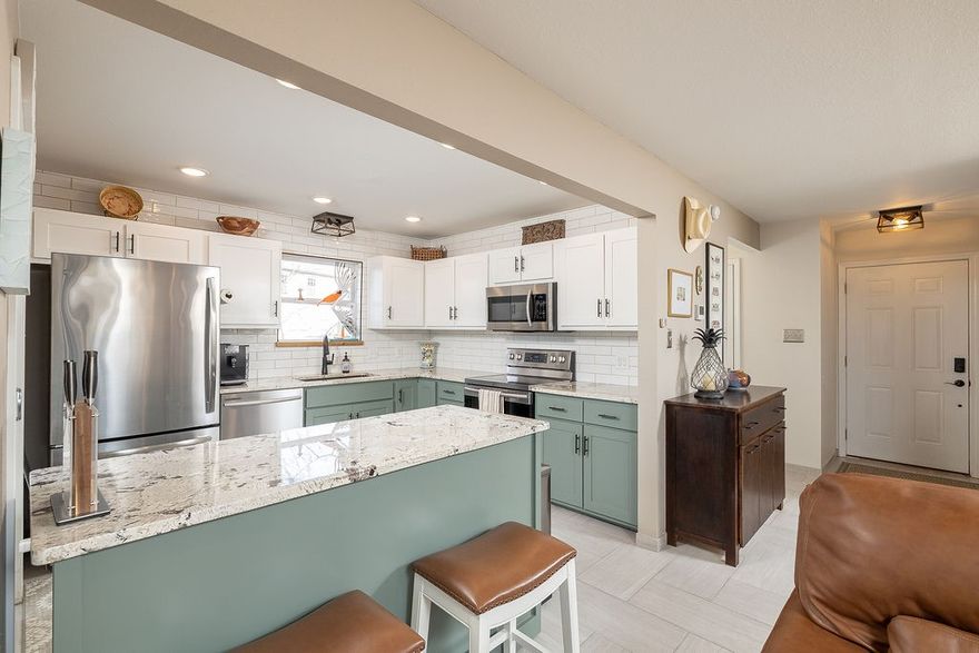 Situated at College and Township, this 3-level, thoughtfully improved 3-bedroom, 2.5-bath condo offers a flexible layout for students, professionals, families, or guests. The location provides prime city access while remaining privately tucked away on a wooded hillside. Recent updates include a fully remodeled kitchen with a new island and a generously expanded deck designed for enjoying unmatched sunset views. 
The main level features the living room, kitchen, dining area, powder room, and access to the elevated deck. Upstairs includes the primary suite with full bath and walk-in closet, along with a second bedroom and walk-in closet. The walkout lower level offers a second primary bedroom and full bath, plus a family room, laundry area, and access to the covered ground-level deck.
This property is professionally landscaped for low-maintenance living and includes a fenced yard with direct stair access from the elevated deck. Walk to Starbucks and minutes from Gulley Park. Come see it today!