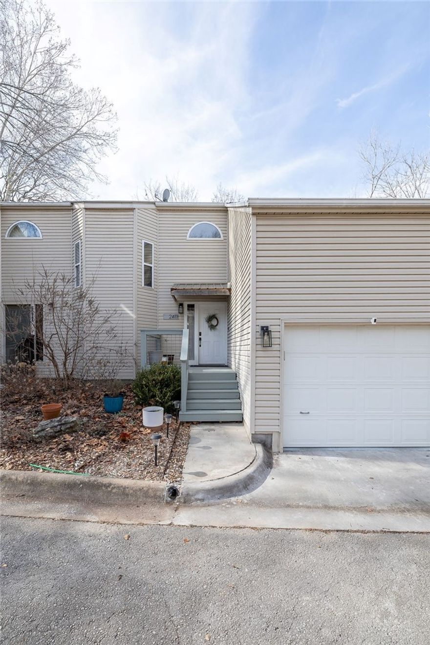 Located at College and Township, this 3-level, thoughtfully improved 3-bedroom, 2.5-bath condo offers prime city access while remaining tucked away on a wooded hillside. Recent updates include a fully remodeled kitchen with a new island and a generously expanded deck designed for enjoying unmatched sunset views. This property is professionally landscaped for low-maintenance living and includes a fenced yard with direct stair access from the main deck. Walk to Starbucks and minutes from Gulley Park. Schedule a viewing today and wrestle with whether to stay inside or out.