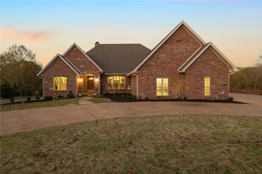 This exceptional 4-bed, 4.5-bath custom home, set on over 3 acres in Riverlyn Estates, offers high-end craftsmanship and timeless design along the White River in East Fayetteville. Spanning over 5,300 SF, the main level includes 2 beds, 2.5 baths, a gourmet kitchen, large screened-in deck, and walk-in laundry room. The expansive lower level features a full walk-out basement with a second kitchen, laundry, 2 beds, 2 baths, flex room and a cedar-lined safe room. Recent updates within the last 2 years include all new paint, refinished white oak flooring, new carpet, HVAC systems, water heaters, & appliances. A new roof & a Sub-Zero refrigerator were installed within the last 5 years. An elevator and ramps were added in the last 2 years for ADA accessibility. Additional amenities include a craft or exercise room, heated/cooled detached garage shop with full bath. Professionally landscaped grounds complete the private, tranquil retreat in this desirable gated community.