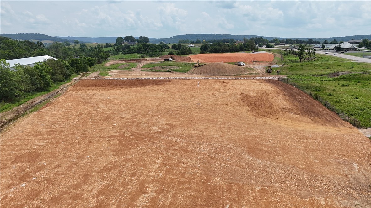 Prime 2.2 acres with over 300ft of Hwy 412 frontage. Zoned dual use (DUZ) with city water/sewer, natural gas, electric, and fiber optic available on site. Desirable commercial location with high visibility and traffic in a growing area. Cleared, level with dirt work done. Across from Huntsville Walmart Supercenter and other thriving businesses. Adjoining 1.5 acre lot also available.