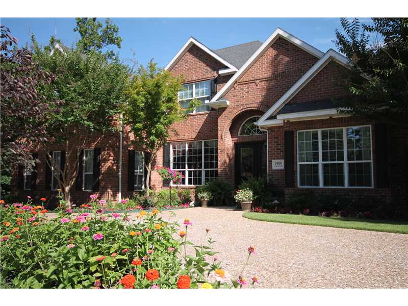 Grand home on a beautifully landscaped lot. Inside and out, this home is breathtaking. Living room boast 2 story ceiling and windows. Fabulous Kitchen has upgraded SS appliances, granite counter tops. Breakfast nook. Cozy Hearth room w/vaulted beamed,ceiling. Upper level 3 BR, 1 private bath & 2 with Jack & Jill. Bonus rm. on upper level. Media Rm with wet bar. 809ft of heated & cooled workshop w/overhead door not included in sq/ft (has 1/2 bath) Epoxy floors in gar & WS 330 sq/ft of greenhouse.