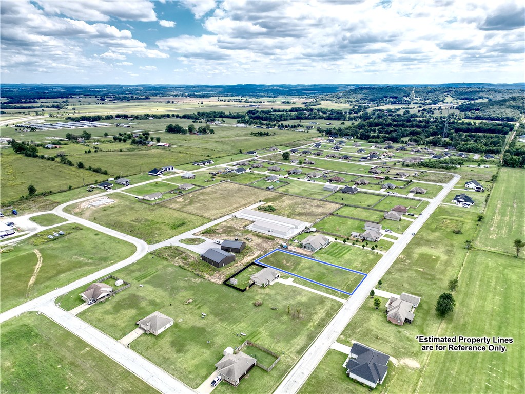 Build your dream home on this beautiful .53-acre lot, located in an established neighborhood with nice homes on oversized lots. Enjoy the peace and privacy of being outside city limits, while still just a 15-20 minute drive from Springdale. This spacious property has access to water and electricity-making it ready for your custom build in a truly desirable setting. Don't miss out. Call today to schedule a private showing.