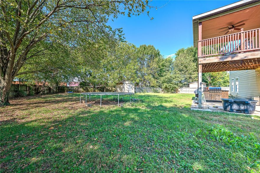 Welcome to 1440 Tumbleweed Drive, a spacious and inviting home in the heart of Springdale. Situated on a large, flat 0.44-acre lot, this beautiful property offers 6 bedrooms and 3.5 bathrooms, providing plenty of room for family, guests, and entertaining. The open and functional layout features bright living spaces, comfortable bedrooms, and ample storage throughout. Enjoy outdoor living at its finest with both a covered patio on the main level and a large second-story covered deck overlooking the backyard, perfect for relaxing mornings or evening gatherings. Conveniently located near schools, shopping, parks, and major highways, this home combines space, comfort, and location, making it the ideal place to call home in Northwest Arkansas.