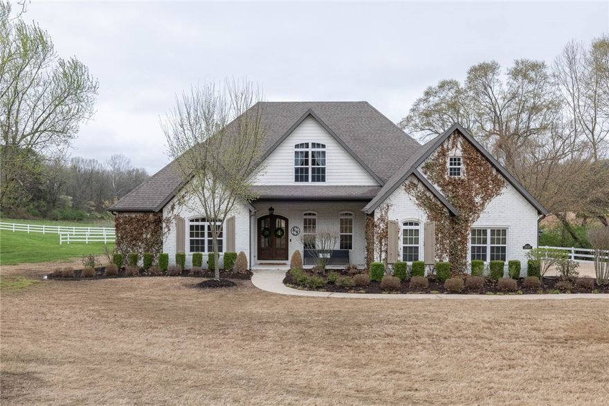 STUNNING modern farm home in desirable East Fayetteville nestled on 1.48 acres. Blending contemporary design & rustic charm, this home boasts hardwood floors, crown molding, large, beautiful windows, open floor plan, formal living & dining. Elegant kitchen features a farmhouse sink, dual ovens, NEW dishwasher in 2021, quartz counters, water purification system, stainless appliances, pantry, & butcher block island. A true retreat, the Owner’s Suite boasts a sitting area, walk-in closet, luxurious bath with claw foot tub, & walk-in shower. Additional main level bedroom has en suite bath. Upstairs you’ll find three bedrooms, one with private bath, while the other two share a jack & jill bath. Interior walls freshly painted in 2021. Outside you will find a screened-in porch, hot tub, firepit, & additional porch off the Living Room with a swing to enjoy beautiful sunsets. Offering plenty of privacy while being just a short drive from local attractions. Don’t miss the opportunity to make this modern farm home your own!