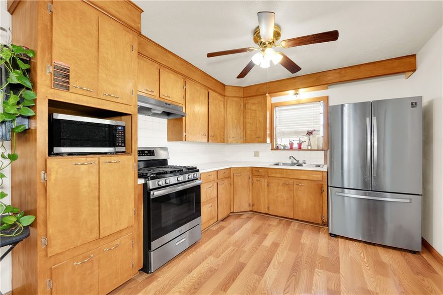 Midtown Rogers - convenient to trails, parks, schools, shopping and restaurants. House sits on the bike path just minutes from Miller Place Park, New Hope Park and Twin Creeks Disc Golf Course. Zoned T4.1 Neighborhood Medium-Intensity for a variety of uses - including live-work building. New roof, exterior wiring and 10x8 shed. Neutral paint with original hardwood floors in the hall and bedrooms and updated LVP in the living areas. Large kitchen with wood cabinets and ceiling fans. 3 bedrooms, one with a large walk-in closet and 1.5 bathrooms. Lots of natural light with backdoor sidelights. Plus 2 bonus rooms for bike storage, pantry, hobby space or bedrooms. Large ¼ acre lot, partially fenced backyard.