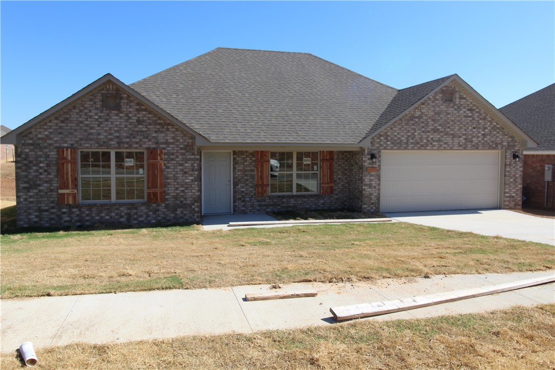 Let us help you get into a beautiful, brand new home in a great Gentry neighborhood! To help lower monthly payments for first two years, seller will pay for a 2-1 Mortgage Buydown, AND up to $5000 toward buyer's closing costs! But there's More!!! This neighborhood is located in a Rural Development area, so qualified buyers could move in with NO DOWN PAYMENT! This 3 bedroom, 2 bathroom home boasts 1488 sq ft split floor plan, with an ample back deck where you can relax after a long day.
Beautiful dark stained cabinetry and flooring provide a sense of elegant living throughout the home. Attached 2-car garage and ample closet space in each room. These homes include: granite counter tops, Full Blinds, Stainless steel appliances: Range, Dishwasher, Microwave. Make an appointment to see today!