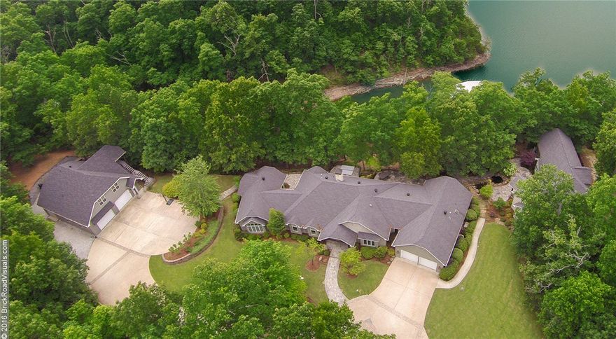 Literally a hidden “MECCA” on Beaver Lake, stunningly elegant yet comfortable home w/3 guest homes on 5+ acres of lake front property on the War Eagle feed.  The home & guest quarters boast many upscale amenities including carefully selected wood & stone features, travertine floors, Thermador Professional appliances & much more. Well thought design for entertaining with spectacular views, outdoor living, H2O feature & stairway to private boat dock.  A lifetime of memories await! (Add’l parcels included)