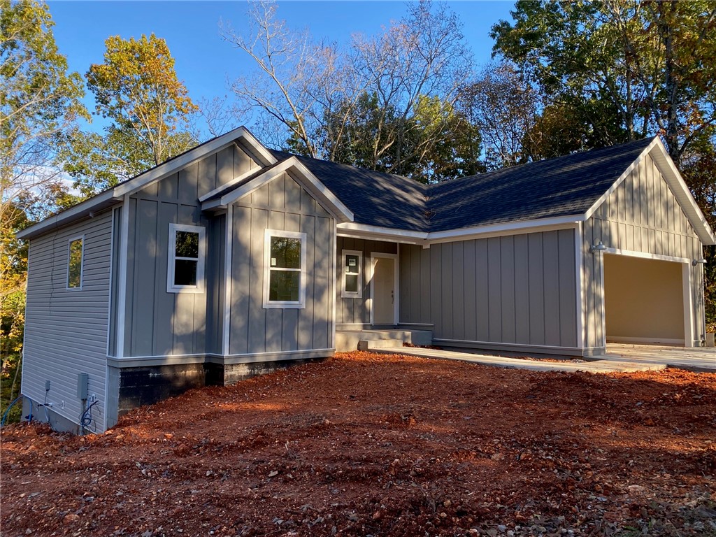 Don't miss out on this large three bedroom two story new home in the Bentonville School District. Home features granite countertops, custom kitchen cabinets, and eat in kitchen. Down stairs you'll find a large family room, two bedrooms, full bath, and large storage room. Master bedroom has large walk in closet and master bath. Home has two covered decks to enjoy!