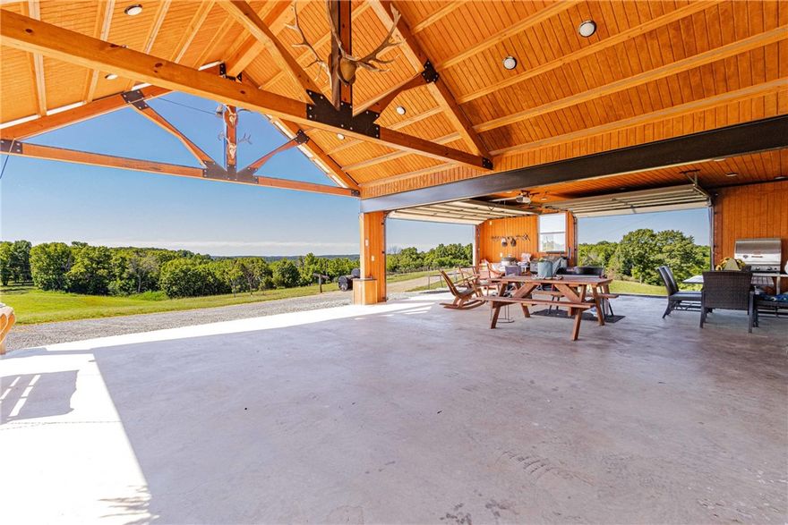 Discover this rare legacy 129 ac m/l retreat with 360° views of Boat Mtn and Crooked Creek. This estate features a 2,458 sf main home (remodeled 2016, new metal roof 2022) with granite counters, stainless appliances, & a concrete storm shelter. A secondary 980 sf farmhouse offers turnkey VRBO potential. Outdoor living shines with a massive pavilion that houses a carport & outdoor kitchen area built with steel I-beams, recessed lighting & garage doors. For the hobbyist, a 30x46Quonset Hut includes 220V power, concrete floors with drains, & pull-through doors. Additional structures include a dairy barn converted to a chicken coop & a"Hillbilly Shooting Shed." The land is a paradise: 36 ac m/l of pasture, 89 wooded ac m/l, & a perimeter ATV road. Enjoy a stocked, aerated pond and 40 fruit trees(Granny Smith, Georgia Peaches, Ruston Red Peaches, Arkansas White Peaches, Pears, and Persimmons too!). This is an ultimate property designed for luxury,utility, and self-sufficiency.