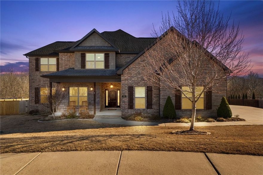 This home boasts a brick and stone facade, setting the stage for a lifestyle of luxury. Unwind or entertain in style on the expansive covered patio, overlooking a sprawling backyard that’s an entertainer’s paradise. Inside, the open-concept design seamlessly blends a gourmet kitchen with a sunlit living area, anchored by a charming stone fireplace tucked into a cozy corner. The kitchen is a chef’s delight with abundant counter and cabinet space, huge walk-in pantry & island. Upstairs, a versatile bonus room awaits, with a sleek wet bar for effortless hosting. The study—or optional formal dining room—offers sophistication behind elegant French doors. The primary suite features a spacious walk-in closet and convenient access to the laundry room. The neighborhood enhances this idyllic lifestyle with a community pool, pickleball & basketball courts, a scenic walking trail, and ponds brimming with fish. This beautiful home can be your own slice of paradise.