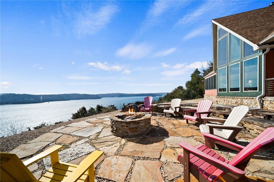 One of the most spectacular views of Beaver Lake if not THE most spectacular!! Don't miss an opportunity to own a beautiful lake home! Discover luxurious living in the rustic designed recreational family compound. This 4,000+ square foot home is positioned atop a 5 acre parcel which includes panoramic views of beautiful Beaver Lake as the perfect backdrop. What's Special? Meticulously Maintained! Three Living Areas! Kitchen with Custom Cabinets and Granite Countertops! Split Bedroom Layout Featuring and In-Law Suite! Vaulted Ceiling with Gorgeous Windows! Game Room Complete with Kitchenette, Full Bath and Bedrooms! Large Unfinished Bonus Room over the garage! Screened in Porch Breezeway! Firepit with Patio for Relaxation and Entertaining! Included is a 10x30 Boat Slip in Community Dock! Experience the joy of lake living, the possibilities are endless! Schedule your showing today.