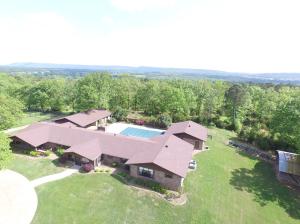 Horse ranch with 5150sqft home overlooking 50 acres of rolling hills! Fenced and cross fenced for livestock,60x95 and 30x40 barns with stalls, and outbuildings allowing ample storage. 2 living and kitchen areas, in-ground pool, pool house, and sun-room facing the distant views of mountains! 30x50 3 car garage See also MLS# 16-2362