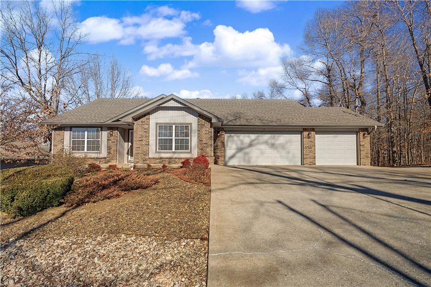 Beautiful one-owner home in the heart of Bella Vista, masterfully maintained and move-in ready. This 3-bedroom, 2.5-bath property offers a rare 3-car garage—hard to find in this price range—along with soaring cathedral ceilings that create an open, inviting feel. The kitchen features granite countertops and flows seamlessly into the main living space, perfect for everyday living or entertaining. Step outside to enjoy the covered deck, ideal for relaxing year-round. Conveniently located near shopping, restaurants, bike trails, and the fire station. This home blends comfort, practicality, and location. Plus...there is an additional 630 square feet of finished, heated and cooled space in the lower level that is not counted in the overall square footage. It even comes with a half bath and a double door walkout entry! Washer, dryer, and two refrigerators convey, adding even more value. A truly special opportunity in Bella Vista.