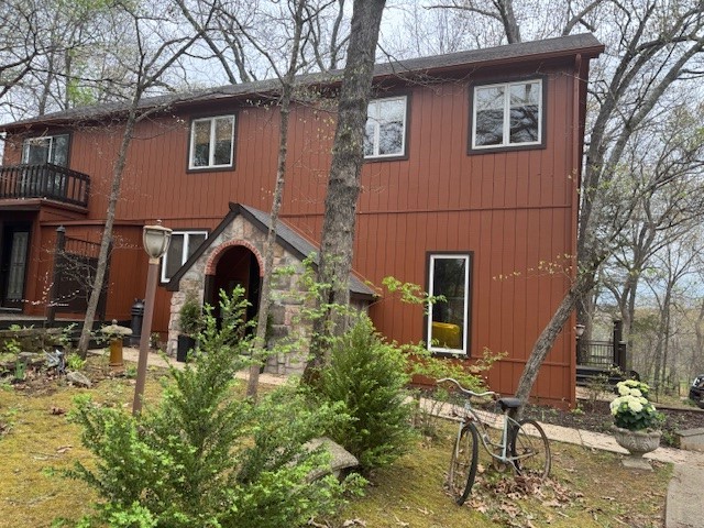 This town gem with a country feel is in the perfect location. Private back yard is backed up to woods. Loads of charm and comfort in this 4br, 3ba home , plus a studio w/ 1/2 bath and 3 adorable sheds all with elec. and 1 with water. Lots of entertaining decks on front and back. Features wood and stone entry with fireplace, open concept, vaulted ceiling, two sinks, two dishwashers, granite counters and island in kitchen. Bedroom on main level has bath with walk-in shower. Upstairs is newly carpeted with three more bedrooms and a walk-out balcony. Primary bedroom has en-suite bath with fireplace, walk-in shower, whirlpool tub, walk-in closet and utility closet with w/d hookups. The other two bedrooms share Jack and Jill bathroom with tub/shower and new vanity. This place has it all.. comfort, beauty, convenience and privacy... all in town.
