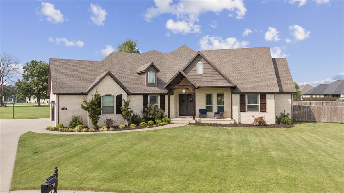 Estate living at it's finest 1.2 acres just 12 minutes from the University of Arkansas. This all brick beauty is designed for entertainment inside and out. Everyone knows the kitchen is the heart of the home, and this entertainers kitchen is perfect for the role. Cook for a crowd with your double oven, five burner gas cook top, and pot filling faucet. The huge farmhouse sink has plenty of room for your oversized pans. The enormous living room boasts a beautiful fireplace, but for intimate gatherings and conversations, you'll love the sunroom with it's own cozy fireplace as well. The split floor plan provides privacy for everyone, and guests will appreciate the second primary bed/bath! Schedule your personal tour today!