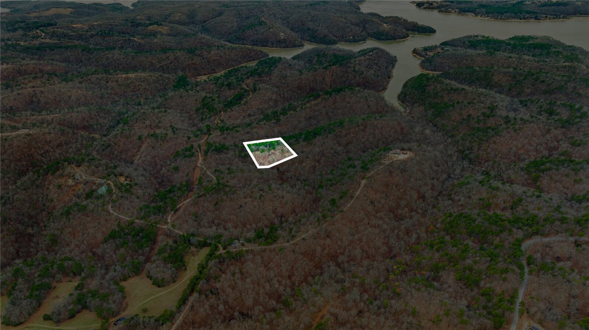 Discover the perfect canvas for your dream home with this stunning 5-acre tract in Emerald Bay subdivision. Boasting breathtaking views and endless potential, this property offers a serene retreat near the lake. While well water and septic are needed, electricity is already on-site, making your building process more convenient.
Located just minutes from the historic War Eagle Mill and a short drive to downtown Rogers, youāll enjoy the perfect balance of peaceful living and easy access to amenities. Whether youāre envisioning a custom home or a weekend getaway, this property provides the ideal setting to bring your vision to life. Donāt miss this rare opportunity to own a slice of Emerald Bay!