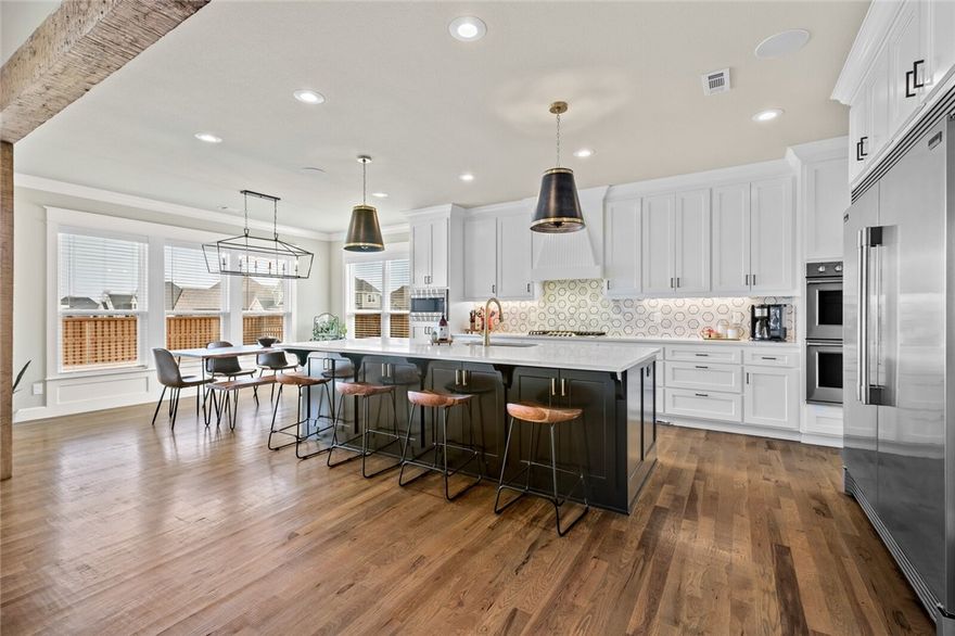 Spectacular built home located on a large corner lot in sought-after gated Scissortail subdivision. Noteworthy designer features include gorgeous wood floors, elevated ceilings with accent beams, extraordinary millwork, oversized windows, mahogany French doors, and custom built-ins. This desirable floor plan features a stunning entry hall, formal dining room, great room with custom built-ins and shiplap fireplace, private study, a main level owners suite and four secondary bedrooms along with a generous sized bonus room with a wet bar. The open gourmet kitchen with custom cabinetry, high-end appliances, walk-in pantry, flows to the dining and great room wall of windows showcasing the outdoor entertaining areas with covered patio and built-in grill. The luxurious owner’s suite includes a beautiful bathroom offering a free-standing soaking tub, oversized shower, and a huge walk-in closet! This one will not last long!