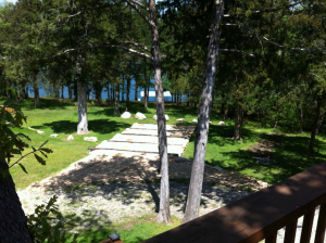 LAKESIDE GEM WITH BOAT DOCK! 3 BR, 2 1/2 BA home updated including doors, windows and appliances and metal roof. Open floor plan. Rec Room. Workshop in basement. Large decks. 2-stall boat dock with swim platform in private cove. Propane generator. Pole Barn. Nice garage/shop bldg. w/awning for RV. Private location on 2.19 acres m/l.