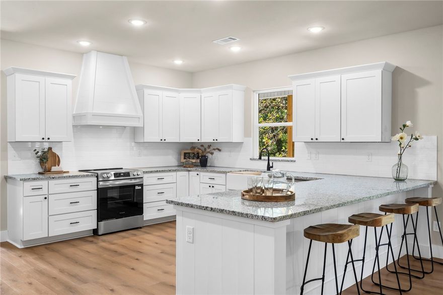 Imagine coming home to this new construction country retreat on a private 1-acre lot, complete with 2 spacious living areas! Step inside through the mudroom and into a bright, open kitchen featuring granite countertops, white shaker cabinetry, and windows framing wooded views. A massive walk-in pantry keeps everything neatly tucked away. The main floor’s open design is ideal for cooking, entertaining, or simply enjoying the peaceful country setting. Unwind in the main-level primary suite with its custom-tiled shower, soaking tub, and walk-in closet. A dedicated office makes working from home a breeze, while the oversized 3-car tandem garage and walk-in attic offer plenty of space for hobbies and storage. Upstairs, the flexible second living area is perfect for a media room, play space, or guest quarters. Outdoors, relax on the covered back deck or spread out in the expansive yard—ideal for gardening, play, or hosting friends—all just minutes from E. Centerton Blvd. and I-49, offering both privacy and convenience.