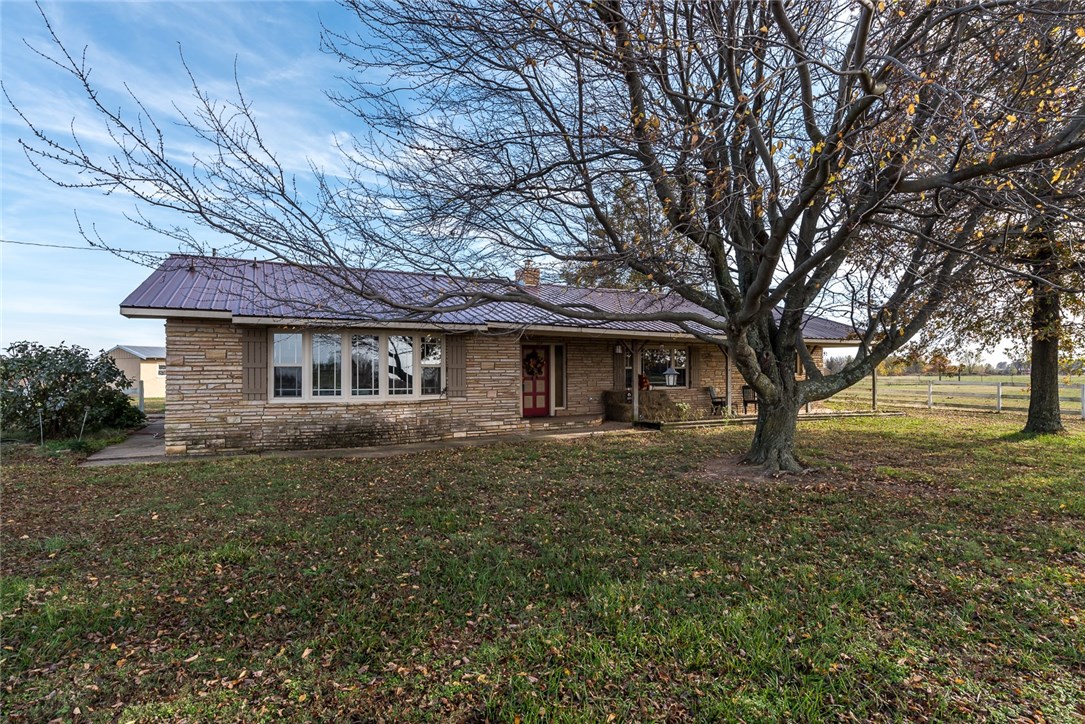 Beautiful setting that over looks the surrounding countryside on all sides! This is a perfect property to raise horses! Fantastic sunsets can be viewed from front porch. House has large kitchen, wood insert fireplace and good sized bedrooms. Schedule a showing today!