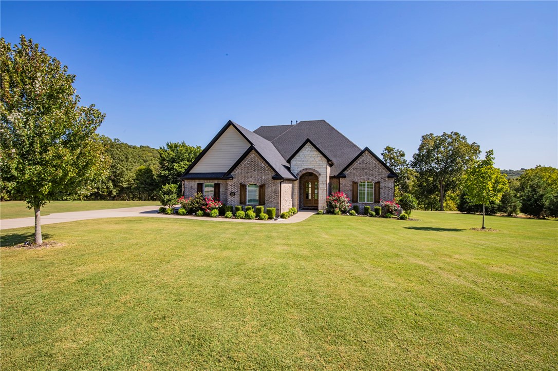 Here is your chance to own a breathtaking home on 2 acres in the highly desired Knolls subdivision in East Fayetteville. Meticulously cared for, this 4 bed, 3 and a half bath home features 3,683 square feet of comfort and luxury. Walking into the spacious living room with its soaring cathedral ceilings is quite the welcome. Sunlight pours through the windows as you make your way to an elegant, gourmet kitchen. From here, you can walk out onto your covered back patio to enjoy the beautiful view. And if all of that is not enough, check out your master suite, which is the definition of privacy and relaxation. With beautiful finishes throughout, this is a home that you would be proud to call your own!