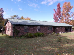 New metal roof and central heat and air makes this home comfortable and affordable, large open kitchen and living room with 3 spacious bedrooms and 3 full baths, relax on the covered back porch while looking over the 1 acre lot, plenty of room for pets or a garden,