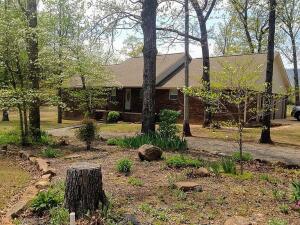 This is a custom built home on 1.5 acres close to town but with a country feel only minutes from Mt. Nebo State Park and Lake Dardanelle. This house has an open floor plan for the living, dining and kitchen areas. Large kitchen with handmade cabinets and island for entertaining or spending quality time with family. There is a large covered back porch and grilling deck with fans to enjoy the wonderful view of Mt. Nebo. Large, detached shop is great for storing boats, atvs or extra vehicles. Hardwood floors throughout house with tile in the bathrooms and laundry room. A new heat pump was installed just 2 years ago. There is also a soapstone wood stove to heat the house during the winter. This neighborhood is arguably one of the best areas within the school district and is a great place
