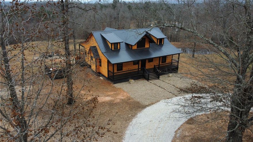 Welcome to your perfect Ozark getaway! This brand-new construction 3-bedroom, 2-bath mountain home is
nestled just 4 miles from the Jasper town square, offering the ideal balance of peaceful seclusion and convenient
access to local adventures.
Step inside to a warm and inviting interior featuring rustic cabin-style finishes, modern comforts, and an open-concept layout designed for relaxing and reconnecting. Whether you’re searching for a full-time residence, a luxury vacation retreat, or an income-producing property, this home checks every box.
Start your mornings on the deck taking in scenic mountain views and wind down your evenings around the firepit with Adirondack chairs—perfect for enjoying fresh Ozark air and star-filled skies.
Ideally located in the heart of Newton County, you’re just minutes from shopping, dining, hiking, biking,
camping, floating the Buffalo National River, zip-lining, rock climbing, and more. Adventure, comfort, and serenity all come together here.