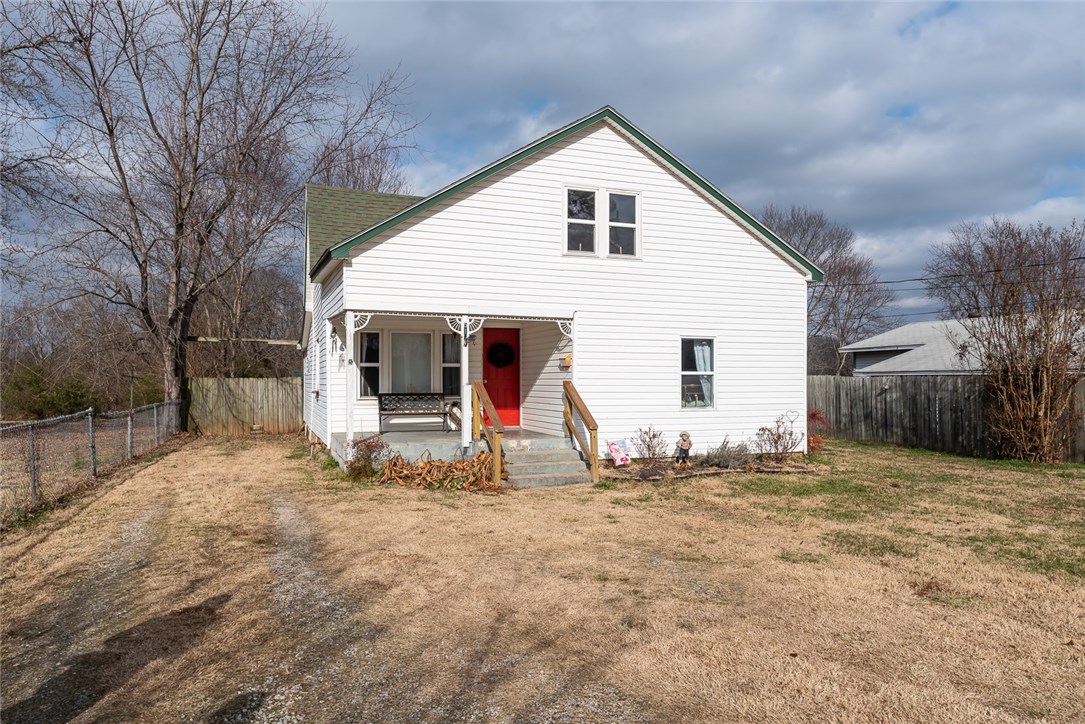 Charming home within walking distance to downtown Rogers. Perfect starter home or investment property with lots of potential. New HVAC in 2012, Bathroom remodeled with new plumbing, ceiling and tile flooring in 2018. New downstairs windows and exterior doors in 2018. New hot water heater in 2018. Home backs up to Rogers Trail System with access to Lake Atalanta. Trails can access from the backyard. Close to downtown Rogers and within walking distance to Rogers Heritage High School.