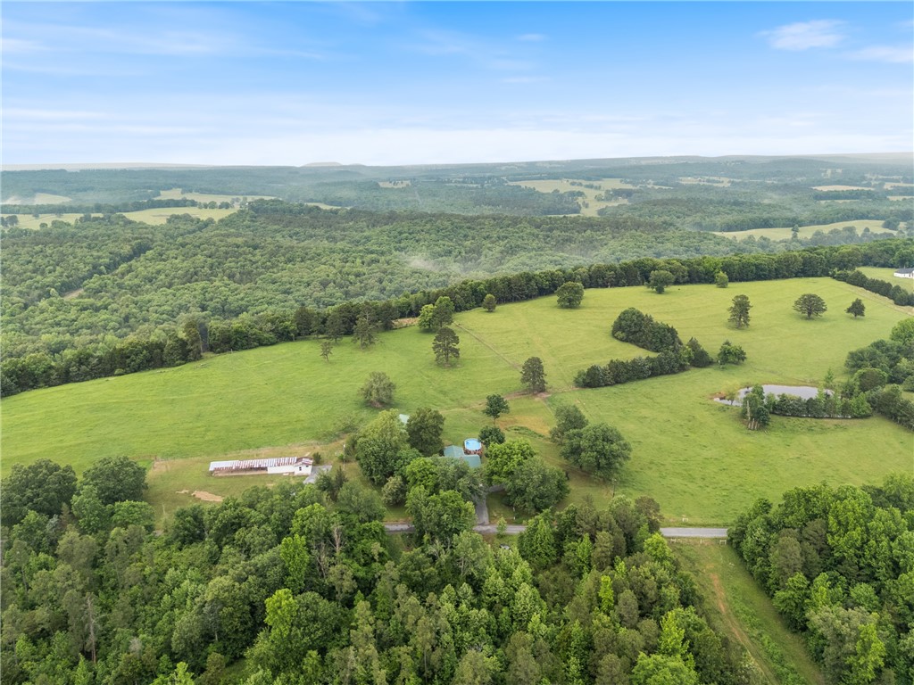 Stunning 56-Acre Farmstead with Waterfront Cadron Creek Access in Central
Arkansas
Just 7 minutes from the award-winning Quitman School District, Cadron Meadows Farm
offers tranquility and scenic beauty across 56 breathtaking acres. Enjoy stunning
sunsets over 26 lush fertile acres of cross-fenced pastureland with 2,500 ft of serene
year-round Cadron Creek frontage.
The Home: Fully remodeled 1,972 sq ft, 2-bed, 2-bath home on a private 3-acre
homestead featuring a modern kitchen, updated baths, spacious sunroom, beautiful
outdoor carpatio, landscaped beds, garden, and relaxing pool.
Farm Facilities: 1,500 sq ft barn with finished office above a spacious
workshop/storage; 1,200 sq ft restored dairy barn; deep water well dedicated for
livestock irrigation.
Livestock and Features: Operating Irish Dexter cattle farm with 7,000 ft of fencing (half
electrified), 15 gates, cattle pen area, four pastures with pond, plus 27 wooded acres
ideal for hunting, hiking, and creek recreation.