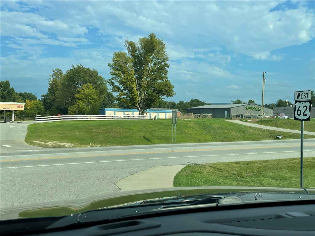 LOCATION! approx. 100 ft. Frontage on High Traffic area on Hwy 62 nestled between existing Business's, this lot is waiting for your Business. Presently has 8- 10 X 20 storage units. Great addition to a new business or remove and built to what you desire.