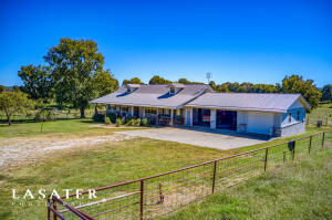 Beautiful Farm on 9 acres, close to town!This 3 BR 1 1/2 bath brick home sits on 9 flat usable acres. Front and back decks for coffee drinking and beautiful veiws! Large open kitchen & dining room with separate Den and Living room areas. Pasture is fenced and cross fenced for cattle or horses. Shed in back. Must see this beautiful customer built home!