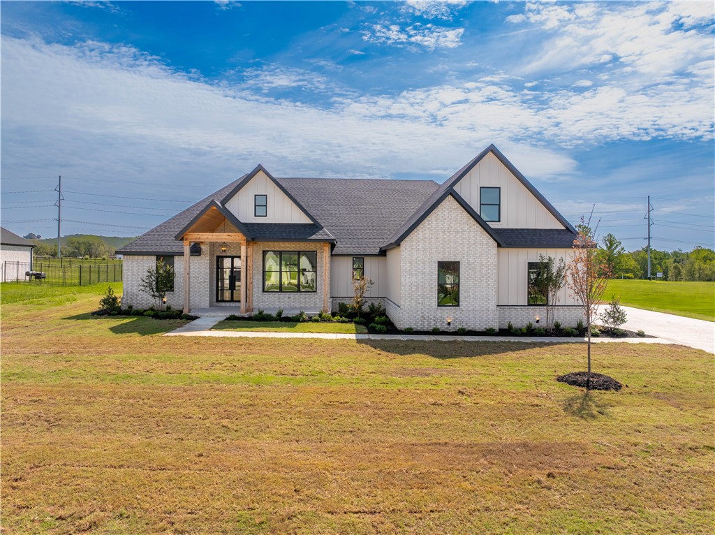 Introducing a stunning new construction home on an expansive acre lot. This thoughtfully designed residence offers a seamless blend of modern luxury and timeless charm. Step inside to discover an open kitchen and living area, adorned with stylish LVP flooring, perfect for casual gatherings or formal entertaining in the adjacent dining room. The master suite provides a serene retreat with dual vanities, a large walk-in closet, walk-in shower and a soaking tub. Two additional bedrooms, a versatile upstairs bonus room, and a 3 car epoxy garage offers ample space for living and storage. Outside, a covered patio overlooks the sprawling yard, inviting you to savor the beauty of NWA living. One of the last homes in Asher’s Ranch, don't miss this opportunity to call this exceptional property home.