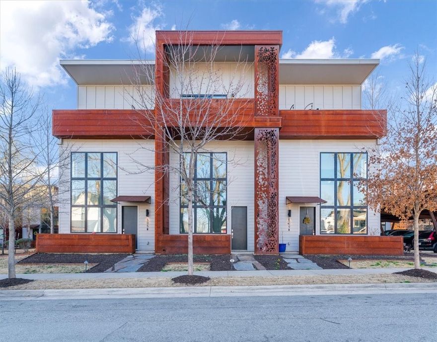 Enjoy one of the best Bentonville locations, Tourmaline Urban Lofts townhome! Where culture, great food, and everyday convenience come together. Hardwood floors run throughout the home, and large front windows fill the open living, dining, and kitchen areas with natural light. The main level includes living room, dining room , kitchen, a convenient half bath and an outdoor seating area with plenty of storage. Upstairs, the second floor offers a private primary suite with its own bathroom. The top level features a flexible space perfect for a home office, workout area, or media space, along with two additional bedrooms and a full bath. One of the bedrooms also has access to a west facing balcony. Two car covered carport parking included. Ideally located just minutes from the Momentary, 8th Street Market, Crystal Bridges, the Bentonville Square, schools, and the Walmart headquarters. This home offers great walkability and an energetic Northwest Arkansas lifestyle.